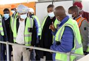 Minister Mr Senzo Mchunu and Deputy Minister Mr David Mahlobo listening to the plant technician 20